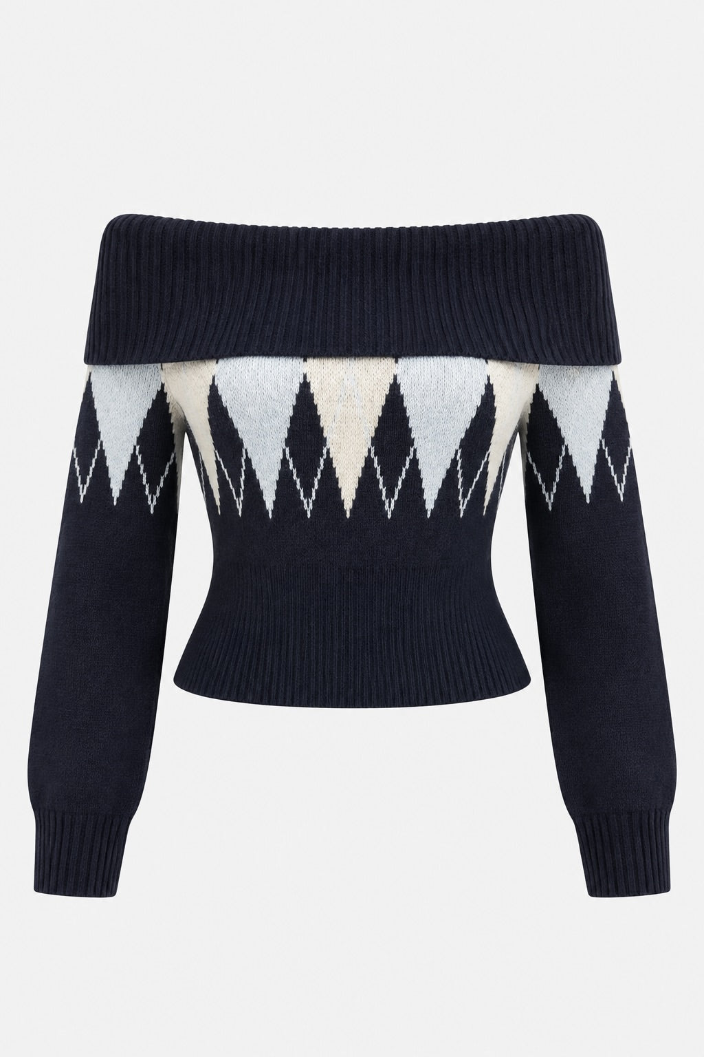 An off-the-shoulder cropped knit sweater featuring a navy blue base with a geometric argyle pattern in white and light gray across the chest and sleeves, set against a plain light gray background.