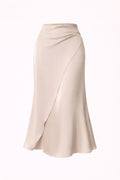 Beige satin skirt on a white background