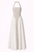White halter neck dress with a long skirt on a white background