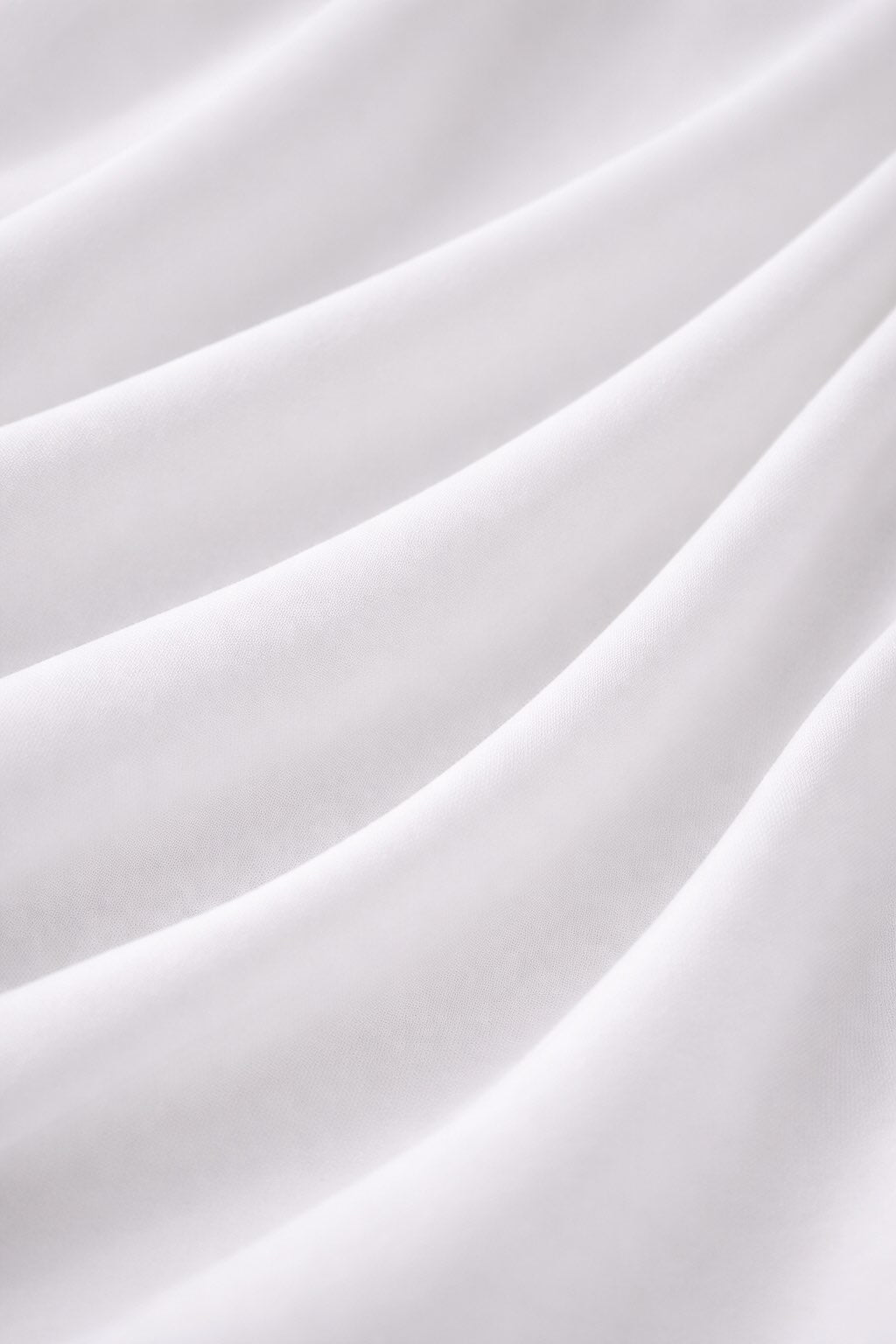 Close-up of white fabric with soft folds