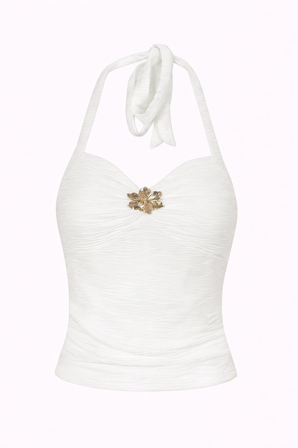 White halter top with a gold brooch on a white background