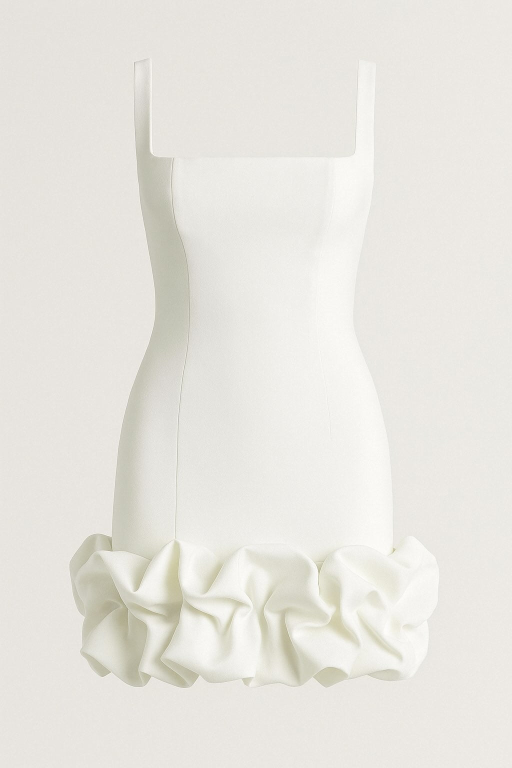 White dress with ruffled hem on a light gray background