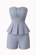 Gray peplum romper on a white background