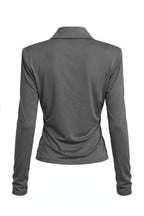 A dark gray long-sleeve collared shirt shown from the back, displayed on a headless mannequin against a plain white background.