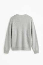 A light gray knit sweater with a crew neck and long sleeves, shown from the back against a plain white background.